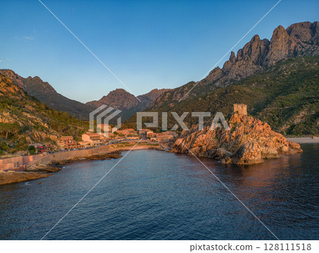 Aerial view town ruins Genoese tower of Porto Corsica France medieval watchtower Mediterranean Sea Calanches de Piana 128111518