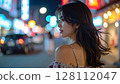 woman looking at night view 128112047