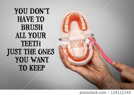 You Don't Have To Brush All Your Teeth Just The Ones You Want To Keep. Toothbrush and Denture Model 128112148