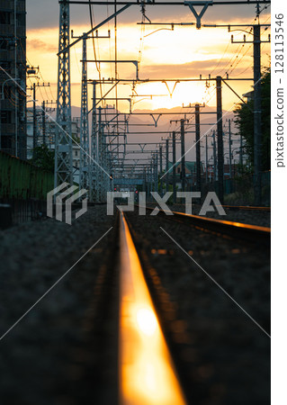 Landscape with sunset and railroad tracks 128113546