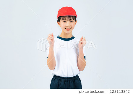 A girl wearing gym clothes doing a guts pose 128113842