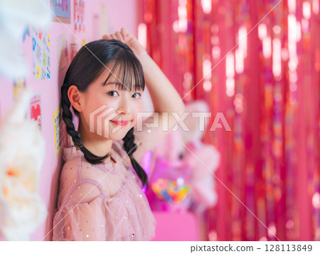 Portrait of a girl taken in a pink room Portrait of a girl taken in a pink room 128113849