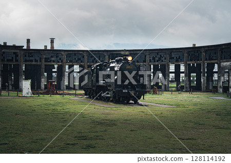 Abandoned steam locomotive and depot 128114192