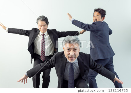 A middle-aged male business person in high spirits 128114735