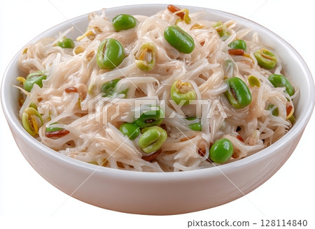 Carrot seedlings, specifically Daucus carota, are depicted in a front view within a white bowl, filled with potting compost, where they are growing as microgreens, green sprouts, and young plants, 128114840