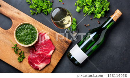 Raw beef carpaccio with chimichurri and white wine on wooden board 128114958