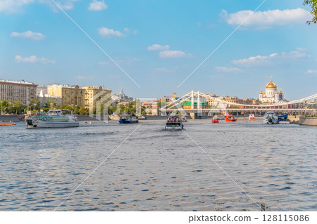 Cruise ship sails on the Moscow river in Moscow city center, popular place for walking. Cruise ship sails on the Moscow river in Moscow city center, popular place for walking. 128115086