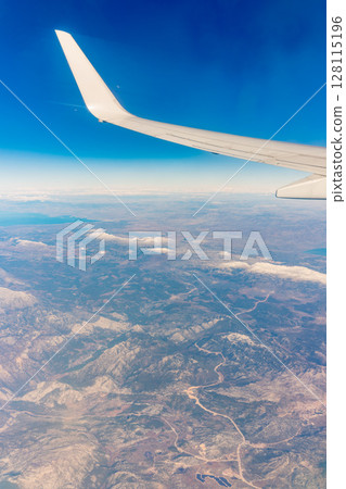 Aerial view on arabian desert and Red sea mountains from airplane 128115196