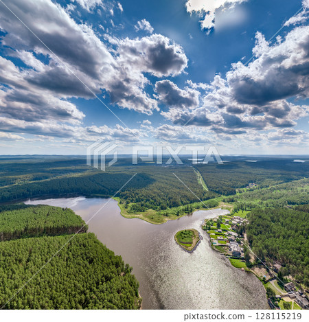 Big lake with green shores in bright sun light, aerial landscape. Recreation concept. Aerial view Big lake with green shores in bright sun light, aerial landscape. Recreation concept. Aerial view 128115219