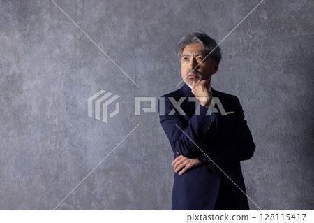 Executive middle-aged male businessman Executive middle-aged male businessman 128115417