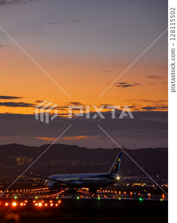 Jet plane taking off at dusk Jet plane taking off at dusk 128115502