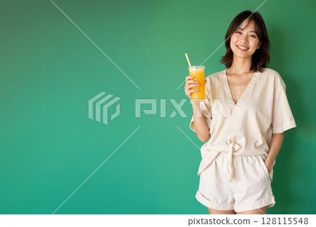 A smiling woman in cool clothes holding juice | Summer lifestyle image [Generative AI] 128115548