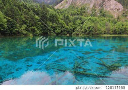 Mysterious blue pond Mysterious blue pond 128115660