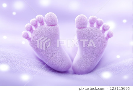 A closeup view of a baby girl's feet is set against a pastel pink blanket that wraps around them 128115695
