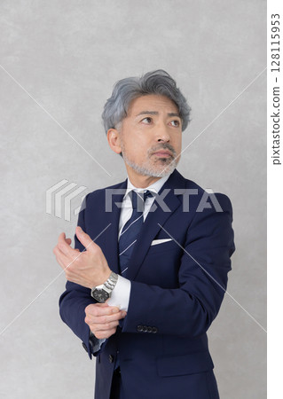 Executive middle-aged businessman 128115953