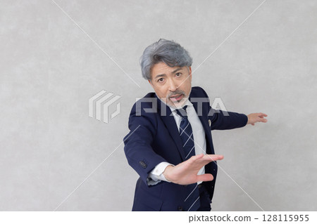 Executive middle-aged businessman running with high energy Executive middle-aged businessman running with high energy 128115955