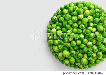 A vertical frame featuring microgreens, specifically sprouted peas, set against a white background 128116067