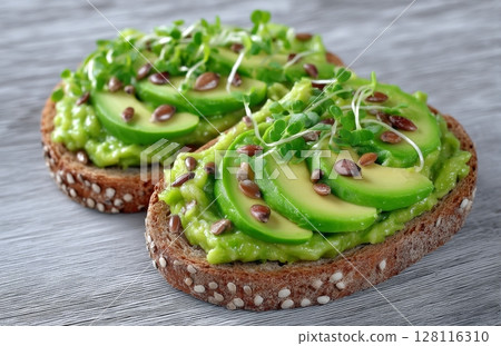 Avocado and microgreen are served on trendy wholegrain toasts Avocado and microgreen are served on trendy wholegrain toasts 128116310