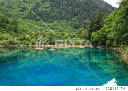 Mysterious blue pond Mysterious blue pond 128116454