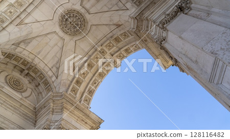 Details of stone archway of Praca do Comercio. Also known as Commerce Square, it is one of the most iconic and grand public squares in Lisbon, Portugal. Details of stone archway of Praca do Comercio. Also known as Commerce Square, it is one of the most iconic and grand public squares in Lisbon, Portugal. 128116482