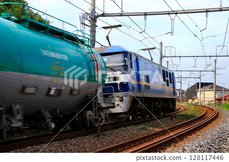 A tank freight train pulled by the electric locomotive EF210 "Momotaro" 128117446
