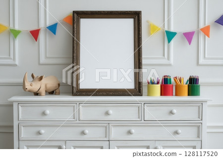 A minimalist and cozy interior is revealed in a real photo of a modern Scandinavian baby room, where a mock-up photo frame, wooden car, plush rhino, and clouds are complemented by hanging cotton 128117520
