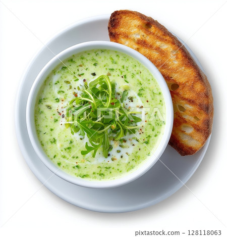 A clean eating concept featuring cream soup with blue cheese, accompanied by bread and microgreens, set against a white background, symbolizing dieting and detox food 128118063