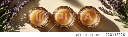 Colorful glass jars filled with cosmetics for face care and skin care on display with natural ingredients present to enhance beauty routine from botanical sources 128118228