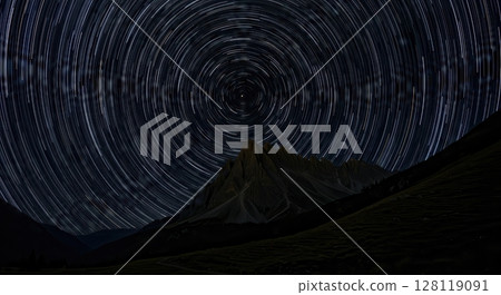 Star Trails Over Mountain Landscape at Night with Clear Skies 128119091