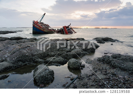 Old wrecked fishing boat on coast of Ang Sila Village, Saensuk Sub-district, Chonburi Province of thailand. 128119588