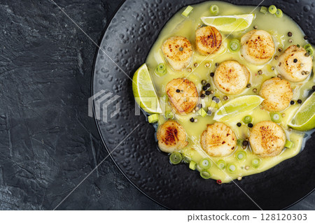 Delicious scallops with sauce. Delicious scallops with sauce. 128120303