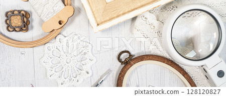 Accessories for hobby. Hoop snaps, scissors, threads, needles and scissors. Vintage tools for embroidery and knitting 128120827