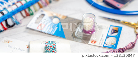 Accessories for hobbies. Needles, threads, hoops snaps, marker, stick for knitting and embroidery 128120847