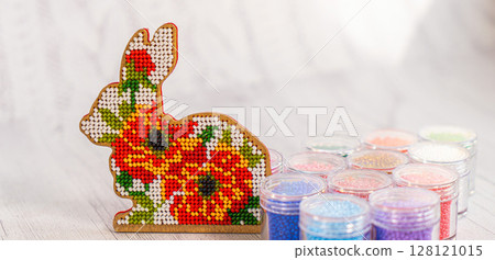 Colorful glass beads. Variety of shapes and colors to make a bead necklace or a string of beads for women 128121015