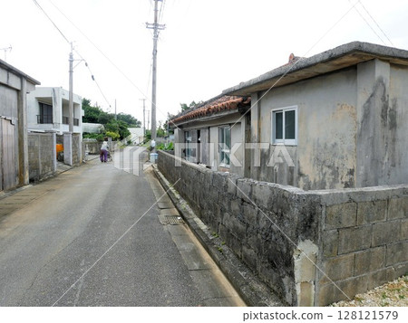 Aging in Okinawa: Elderly people walking through the old streets of Hirara Matsubara, Miyakojima City 128121579