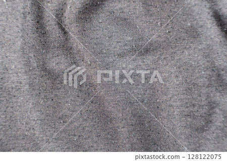 Old worn-out cotton fabric, pilling on a surface 128122075
