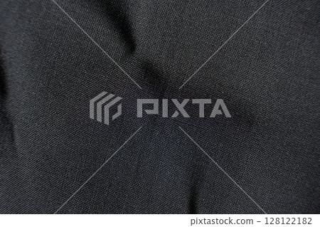 Fabric composed of wool and polyester, macro texture, abstract black fabric background. 128122182