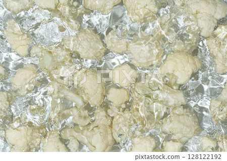 Artistic Cooking Background. Cauliflower in Water Top View, Water Splash Artistic Cooking Background. Cauliflower in Water Top View, Water Splash 128122192