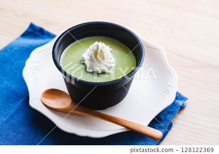 Matcha pudding topped with whipped cream Matcha pudding topped with whipped cream 128122369