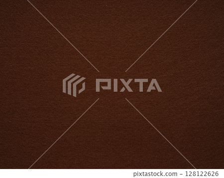 An inviting texture of deep auburn felt, creating a sense of warmth and organic elegance in its simplicity 128122626