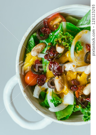 Delicious fruit salad and different fruits, healthy food concept Delicious fruit salad and different fruits, healthy food concept 128123293