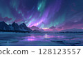 Spectacular aurora dancing over a frozen Norwegian lake 128123557