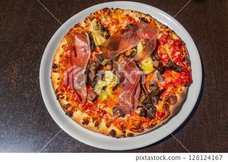 Delicious fresh pizza on a table 128124167