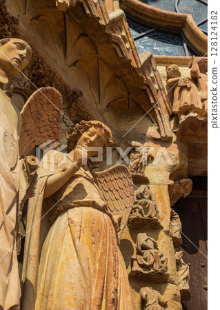 Smiling Angel, also known as the Smile of Reims or Angel of the Annunciation, is a stone sculpture at the Notre-Dame de Reims Cathedral, France Smiling Angel, also known as the Smile of Reims or Angel of the Annunciation, is a stone sculpture at the Notre-Dame de Reims Cathedral, France 128124182