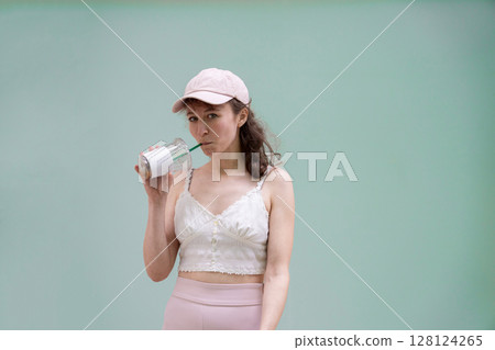 Embracing a Casual Summer Look with a Cool and Refreshing Drink to Beat the Heat Embracing a Casual Summer Look with a Cool and Refreshing Drink to Beat the Heat 128124265