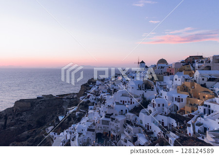 Santorini - The city of Oia and the sea in the distance Santorini - The city of Oia and the sea in the distance 128124589