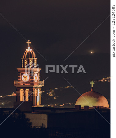 Illuminated church in Fira, Santorini Illuminated church in Fira, Santorini 128124595