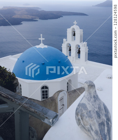 Famous blue dome church in Fira, Santorini Famous blue dome church in Fira, Santorini 128124598