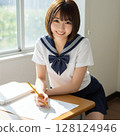 A high school girl in a sailor suit studying with a smile 128124946