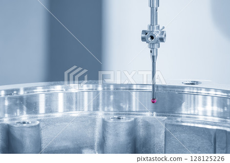 The CMM machine measuring the automotive parts by modular probe in the light blue scene. 128125226